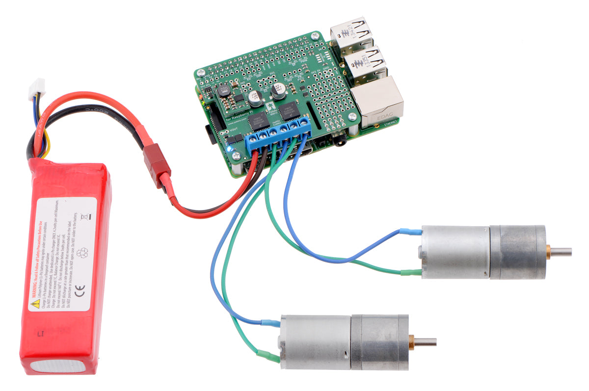 Driving motors with a #2756 dual motor driver on a on a Raspberry Pi Model B+ or Pi 2 Model B. A "step-down regulator":prod0J2831 provides 5 V to the Raspberry Pi.