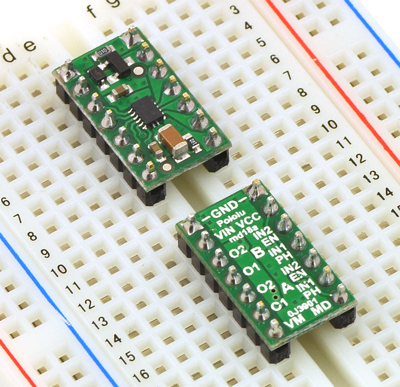 Two DRV8835 dual motor driver carriers plugged into a breadboard.