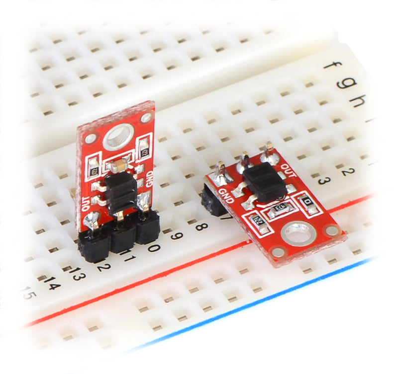 QTR-1A and QTR-1RC reflectance sensors plugged into a breadboard in two possible orientations.