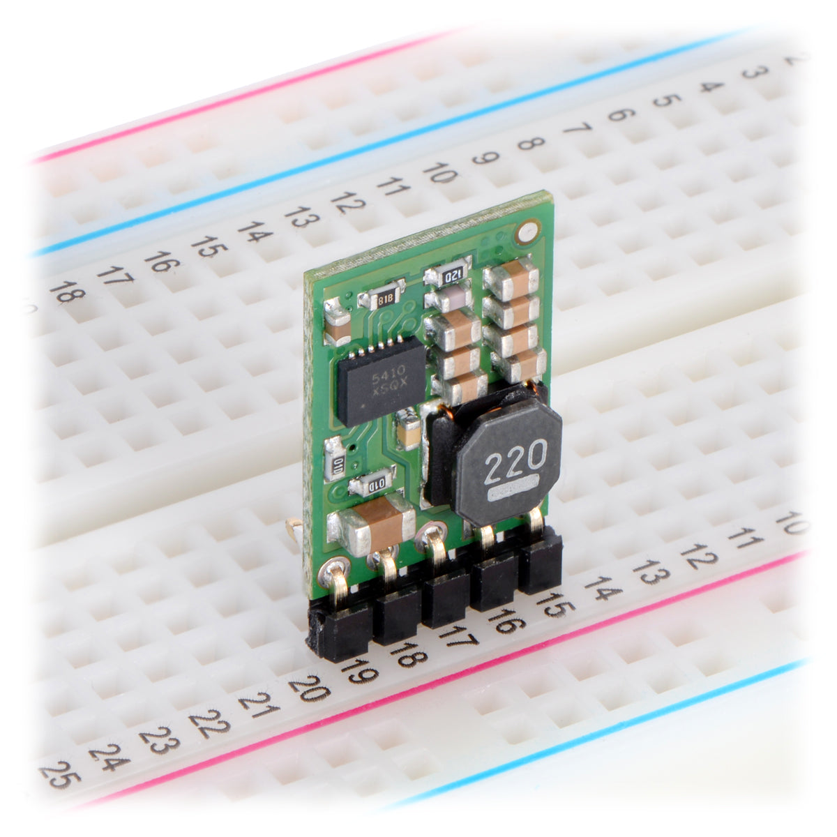 Pololu step-down voltage regulator D24V10Fx in a breadboard.