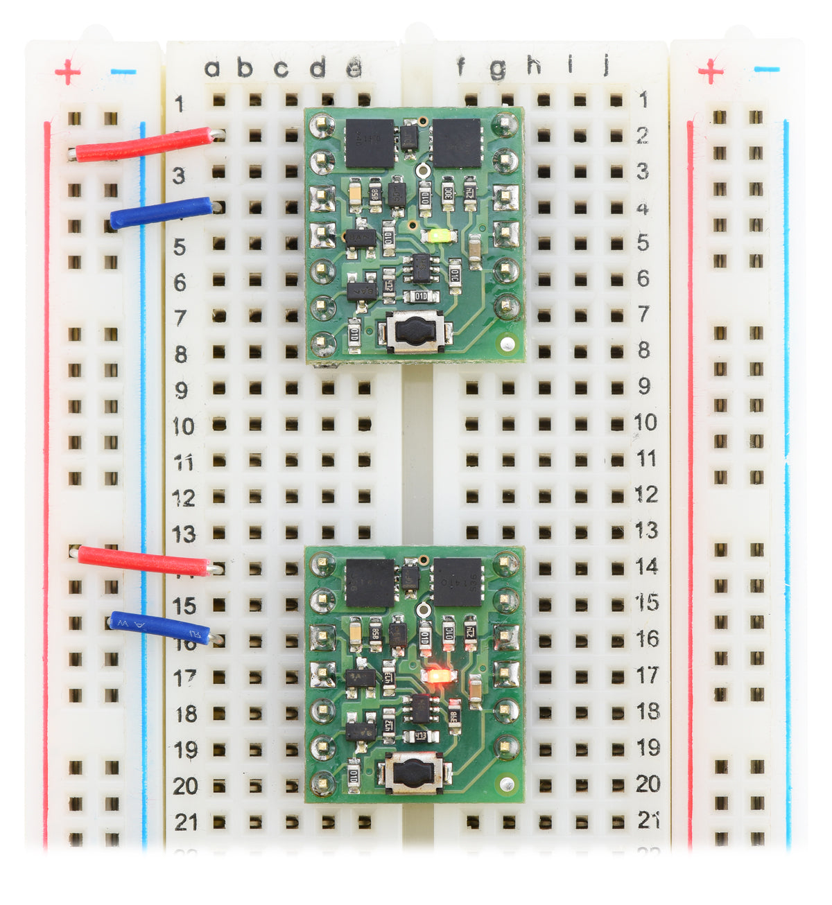 Mini Pushbutton Power Switches in a breadboard (SV version on top and LV version on bottom).